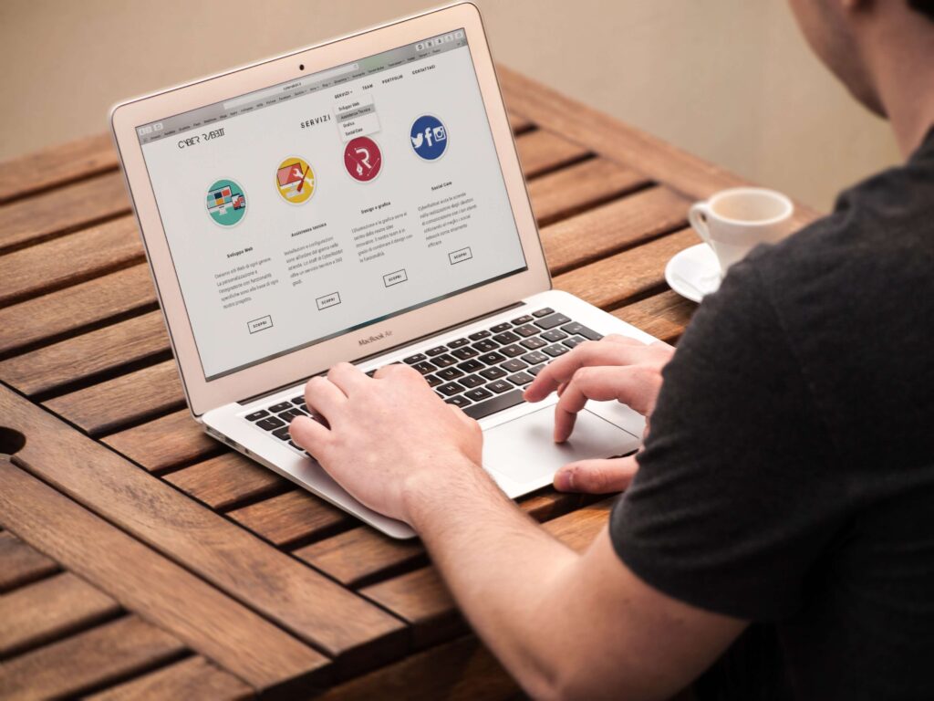 Home person developing a website using a laptop